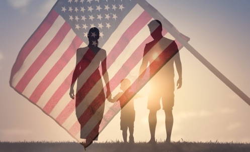 An American flag overlay on top of a family walking.