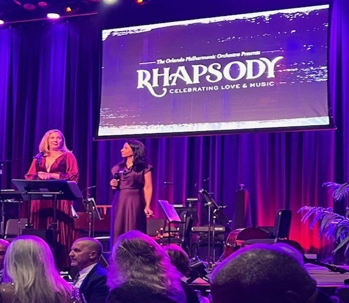 A photo of a speech being given at the Rhapsody gala.